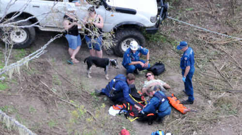 Paramedics attend to a man who suffered a suspected broken leg near Bungundarra forest. Paramedics attend to a man who suffered a suspected broken leg near Bungundarra forest.